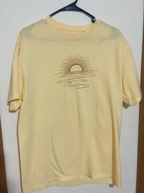 Maurice’s Soft Yellow Sun Graphic Tee, embroidered sun. Nice color,